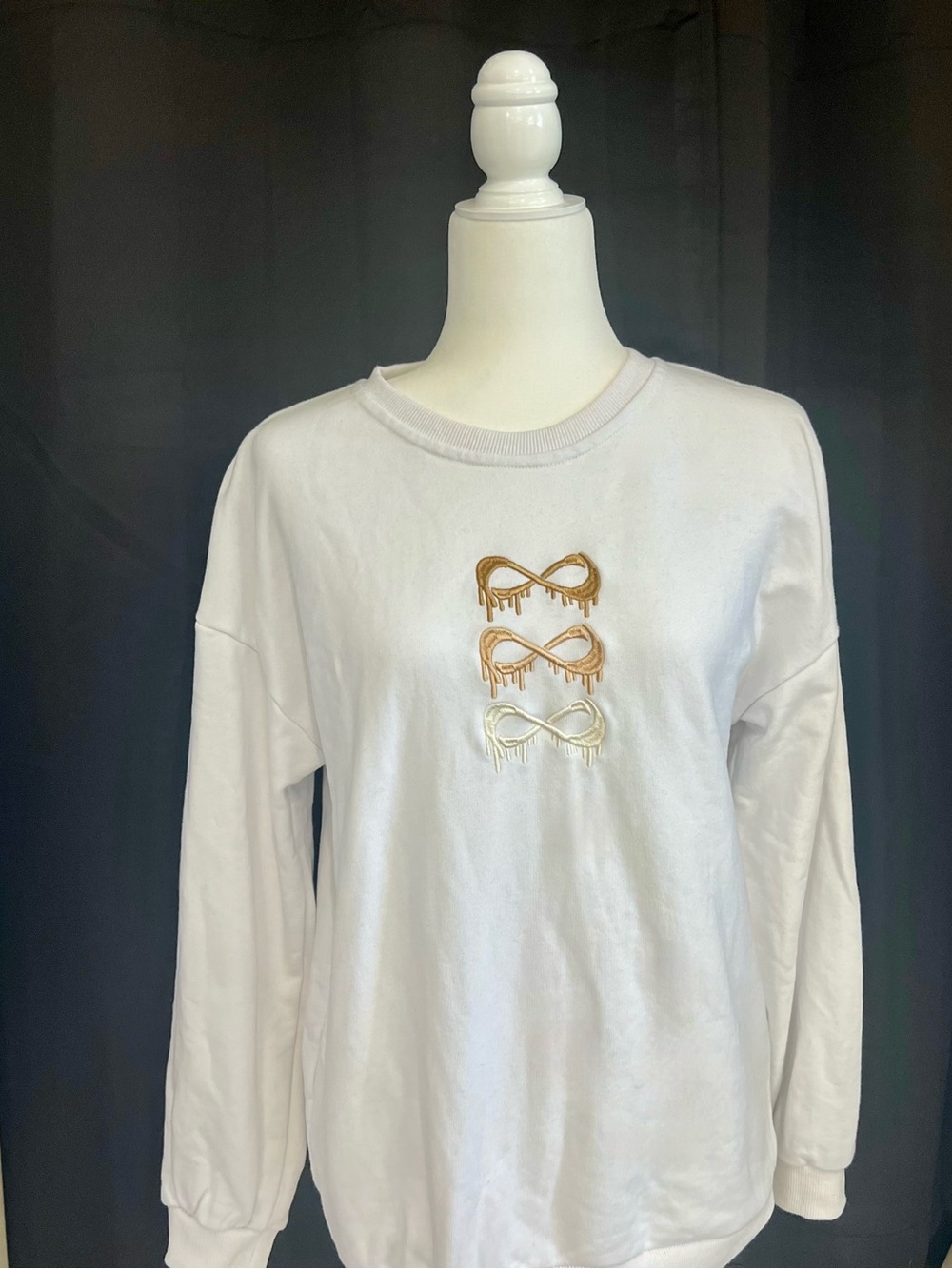 NFINITY White Crewneck Sweatshirt with Gold Metallic Drip Infinity Motifs